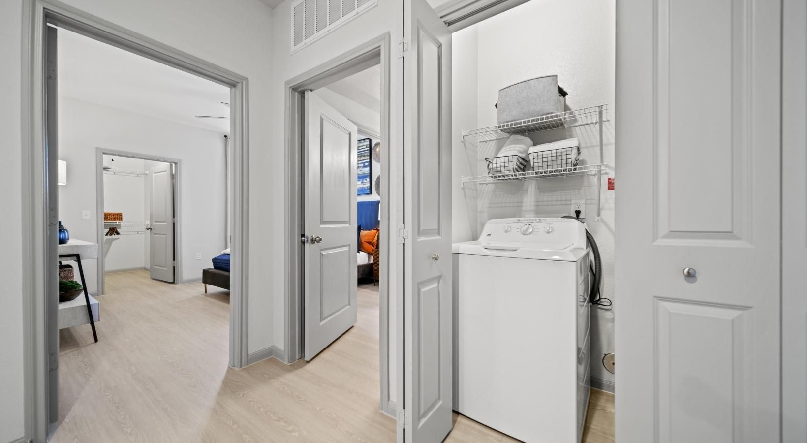 Everything you need right at your fingertips a room with white cabinets and a white machine