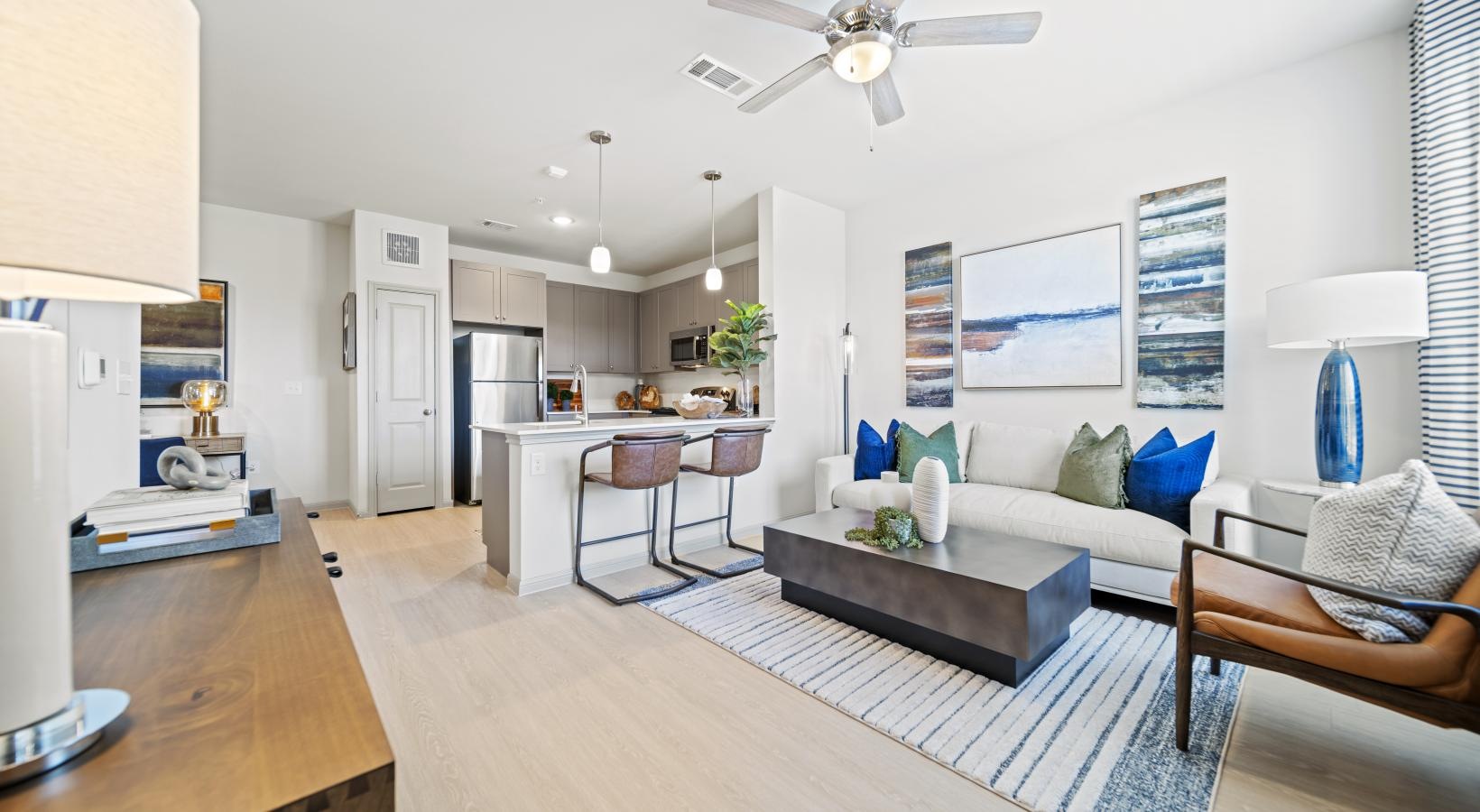 Beautiful living spaces with natural lighting a living room with a couch and a table