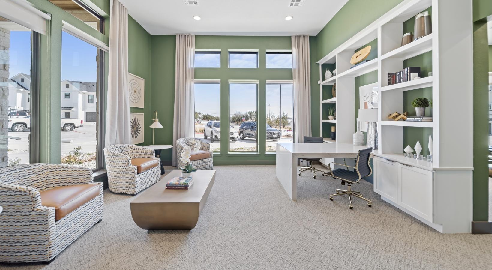 Everything within reach a room with a desk and chairs