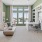 a room with a desk and chairs