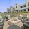 a patio with chairs and tables