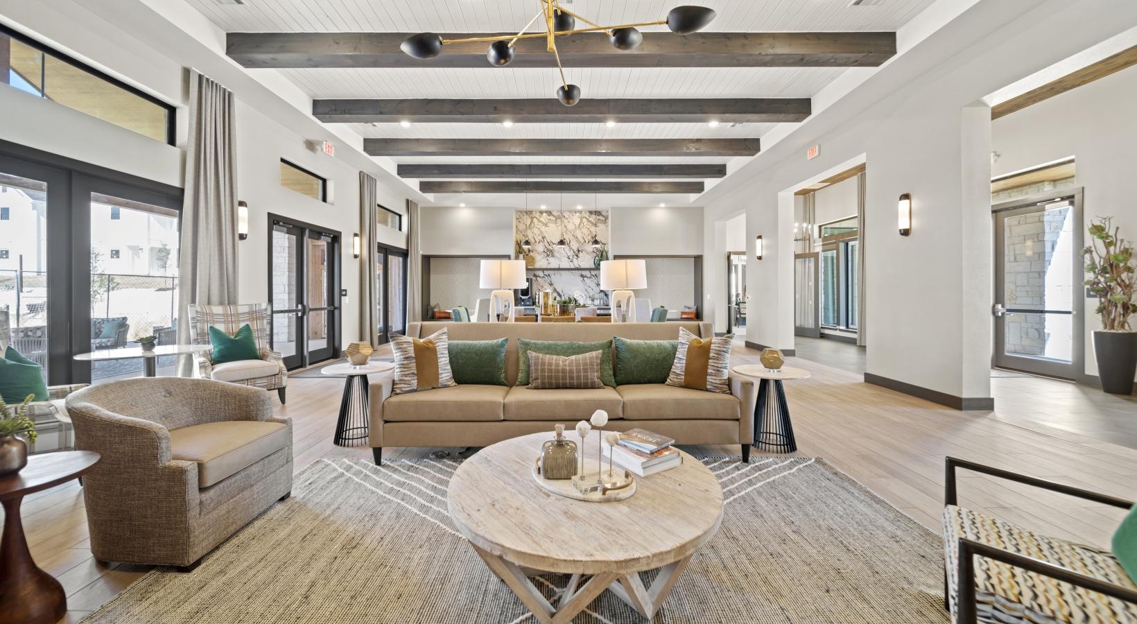 Take advantage of all Emerson at Wells Branch has to offer a living room with a large glass door and a large window