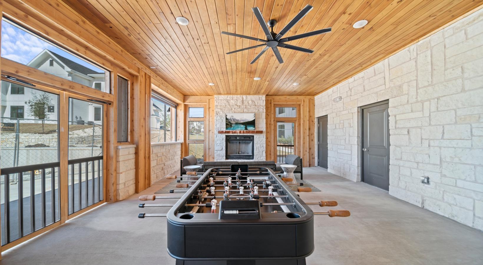 Enjoy our resident-only features a room with a pool table and a large fan
