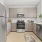 a kitchen with white cabinets