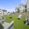 a backyard with chairs and a table