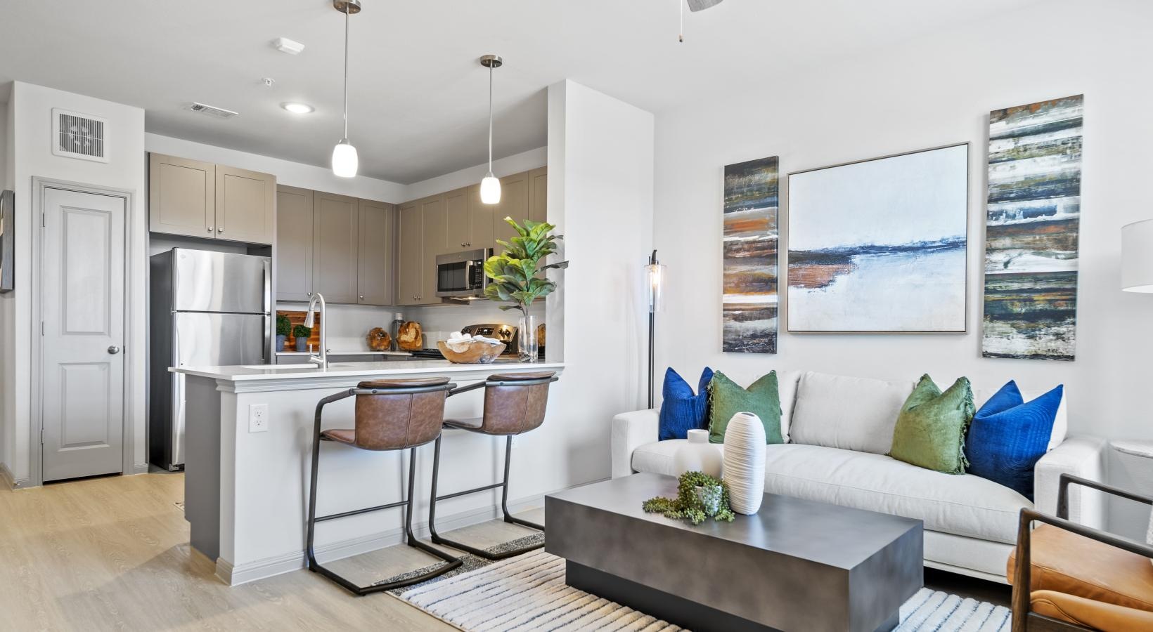 Generous living spaces to relax and unwind a living room with a couch and a table