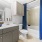 a bathroom with a tub sink and toilet