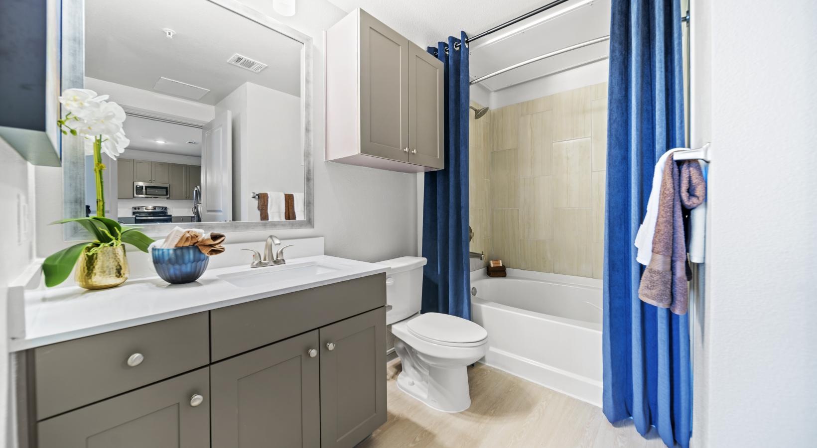 Spacious bathrooms with everything you need a bathroom with a tub sink and toilet