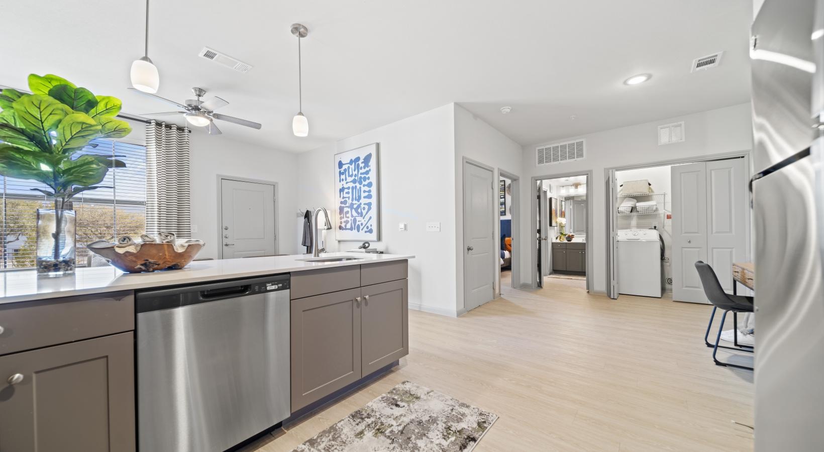 Spacious kitchens with thoughtful details a kitchen with white cabinets