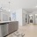 a kitchen with white cabinets
