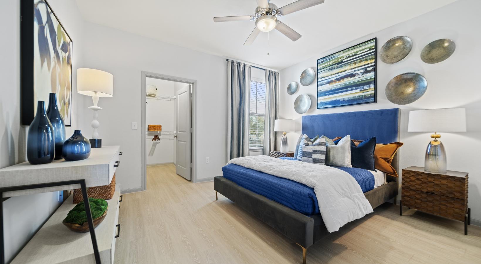 Sleep in style a bedroom with a bed and a fan