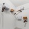 a white room with a white wall and shelves with objects on them