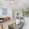 a living room with a table and couches