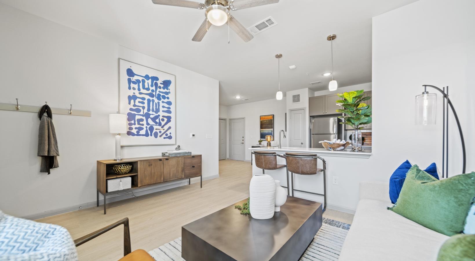 Spacious living areas to recline and recharge a living room with a table and couches