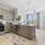 a kitchen with white cabinets
